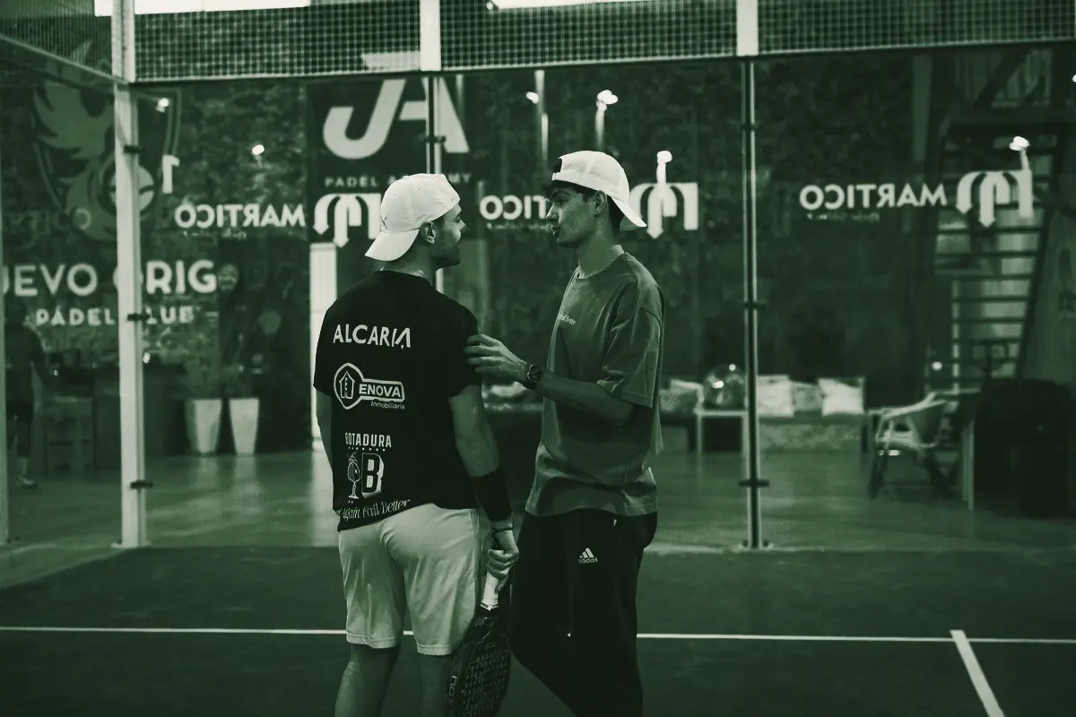 A coach talks a player through the next point